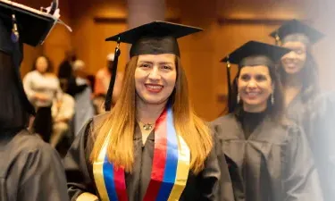 Herzing Idaho Online ASN Student Smiling at Graduation Ceremony